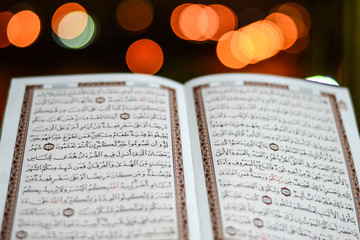 Cairo, Egypt - June 12 2016: Koran with beautiful bokeh of lights background