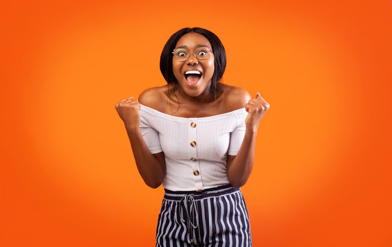 Excited Afro Lady Shouting Shaking Fists Celebrating Success, Studio Shot