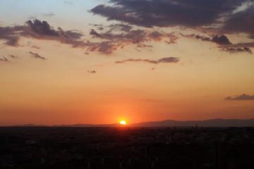 sun hiding across the horizon