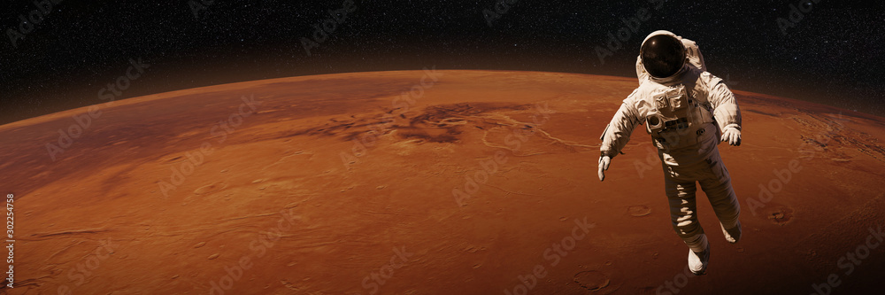 Wall mural astronaut waving during a space walk in orbit of planet mars