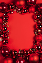 Christmas composition. Christmas red decorations on red background. Flat lay. Christmas and happy new year concept for Christmas promotion banner
