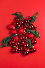 Christmas composition. Christmas red decorations on red background. Flat lay. Christmas and happy new year concept for Christmas promotion banner