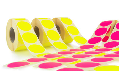 Colored label rolls isolated on white background with shadow reflection. Color reels of labels for...