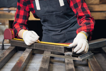 Engineer hands hold tape measure for measuring iron billets construction