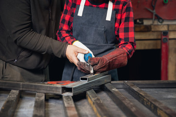 Male teacher use welding this student work in technical school