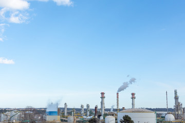 Fototapeta na wymiar view of petrochemical industry with details of chimneys and blue sky