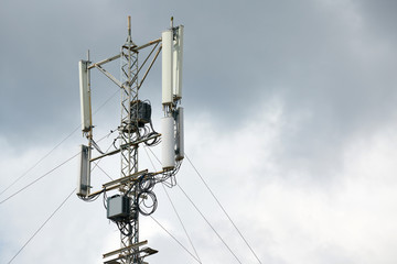 Communication cellular signal tower. 3G, 4G, 5G phone signal base station. Urban antenna repeater...