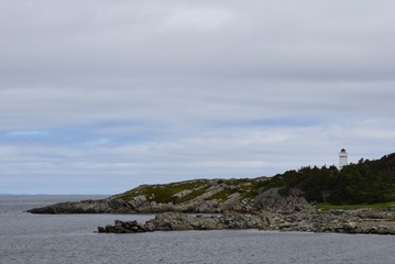 Baccalieu Trail landscape, view across the bay towards the lighthouse, Hant's Harbour Newfoundland Canada
