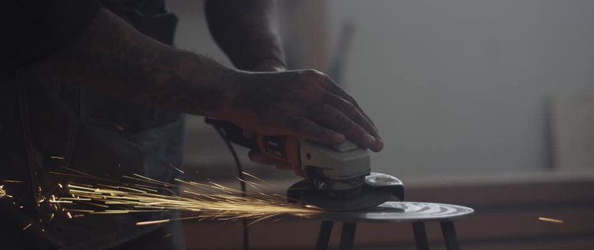 Series of photographs / portrait of a designer / artist, building furniture, photography in nature and industry, developing photos in a darkroom, crafts such as, drilling, grinding, sawing and Tattoo