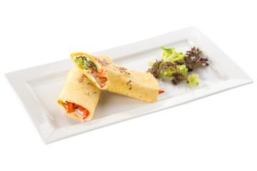 fresh tortilla wraps with vegetables on white plate isolated on white background