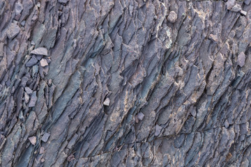 Textured background of pieces of slate stone with gray and brown colors