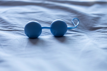  blue vaginal balls in the bed, Kegel balls