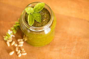 pesto sauce in wooden background