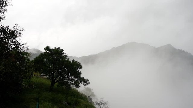 Timelapse of clouds flowing past a view point on a hill in the western ghats of India