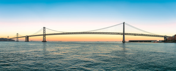 Panoramic view of San Francisco Bay bridge during sunset, California, United States