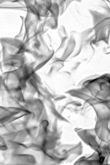 Black smoke on a white background, abstract photo.