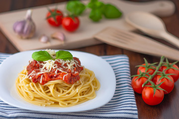 spaghetti with tomato sauce and fresh basil