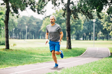 senior man running exercising sport fitness active fit