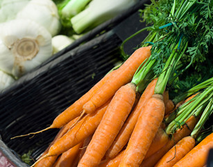 Fresh carrots in supermarket. Concept of healthy food, bio, vegetarian, diet.