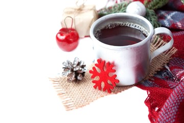 Hot christmas beverage black tea in mug with new year decorations, Cone, present, silver ball, apple, plaid on white background. Winter time top view. Christmas mood