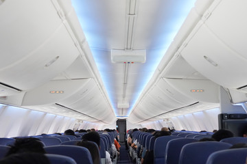 View of passengers on seats inside Aeroplane