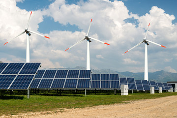 Photo collage of solar panels and wind turbins, alternative electricity source - concept of sustainable resources