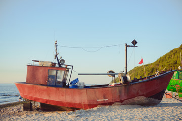 Fototapeta na wymiar fisherman boats at sunrise time on the beach
