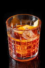 Classic Negroni cocktail isolated on black background.