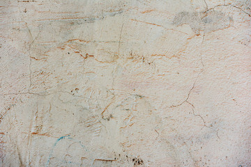 Texture of a concrete wall with cracks and scratches which can be used as a background