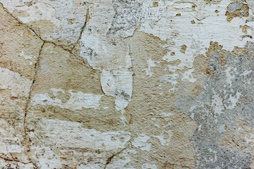 Fototapeta premium Texture of a concrete wall with cracks and scratches which can be used as a background