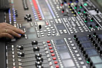 closeup view of the broadcast audio mixing console