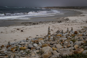 Piles of pebbles on Spanish Bay Beach, California