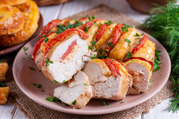 Chicken fillet baked with tomatoes and cheddar cheese
