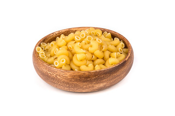 PIle of yellow dried elbow macaroni pasta shapes