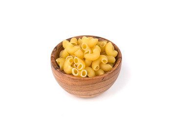 PIle of yellow dried elbow macaroni pasta shapes