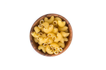 PIle of yellow dried elbow macaroni pasta shapes
