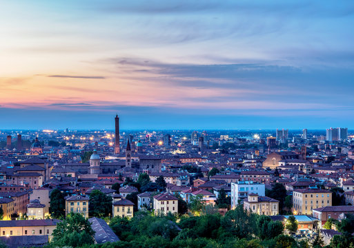 Cityscape with San Domenico Basilica and Asinelli Tower at dusk, elevated view, Bologna, Emilia-Romagna, Italy