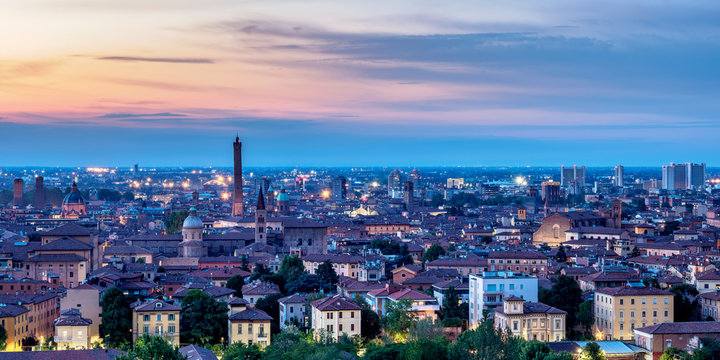 Cityscape with San Domenico Basilica and Asinelli Tower at dusk, elevated view, Bologna, Emilia-Romagna, Italy