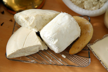 feta cheese . Feta cheese in glass bowl on woofen background. Organic cheese concept .