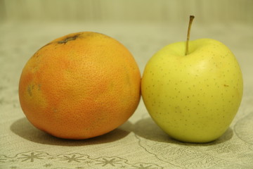 two apples on wooden table