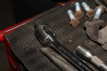 a set of old working tools in a workshop, the work of a mechanic