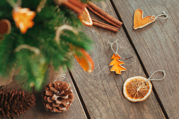 Closeup of dried carved citrus slices for Christmas tree on wooden rustic background