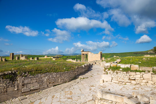 Tunisia, Teboursouk, Dougga archaeological site, Roman road leading to The Capitol, a Roman temple, an ancient Mosque to the left