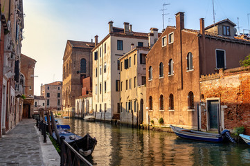 Venice, Italy. Street with old houses and a narrow canal