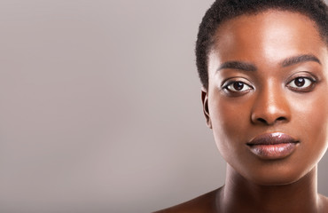 Beautiful afro woman with flawless skin and light makeup