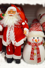 Santa Claus with gifts and snowman.Merry winter holidays.