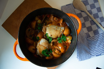 one pot  stewed chicken with vegetables in cast iron pan top view