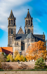 Magnificent Cathedral, Elbe river in golden Autumn colors at downtown of Magdeburg, city center,...