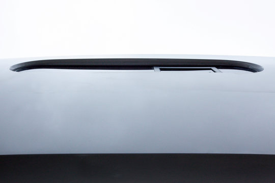 details of a modern shape window on the side of a cruising catamaran