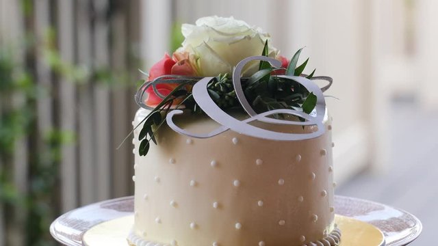 wedding cake stand on table with a white tablecloth 4K